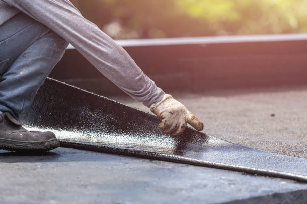 Professional Exterior Waterproofing technician working in Crystal, MI